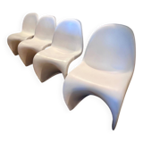 4 white Panton style armchairs