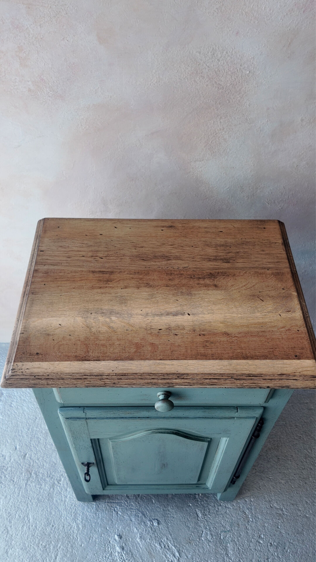 Small vintage side table in sage green patina and solid wood.