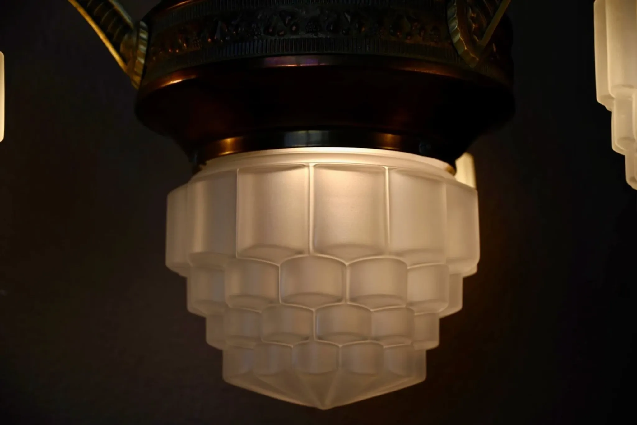 Art Deco lustre in brass and frosted pressed glass from the 1930s.