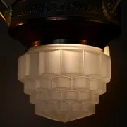 Art Deco lustre in brass and frosted pressed glass from the 1930s.