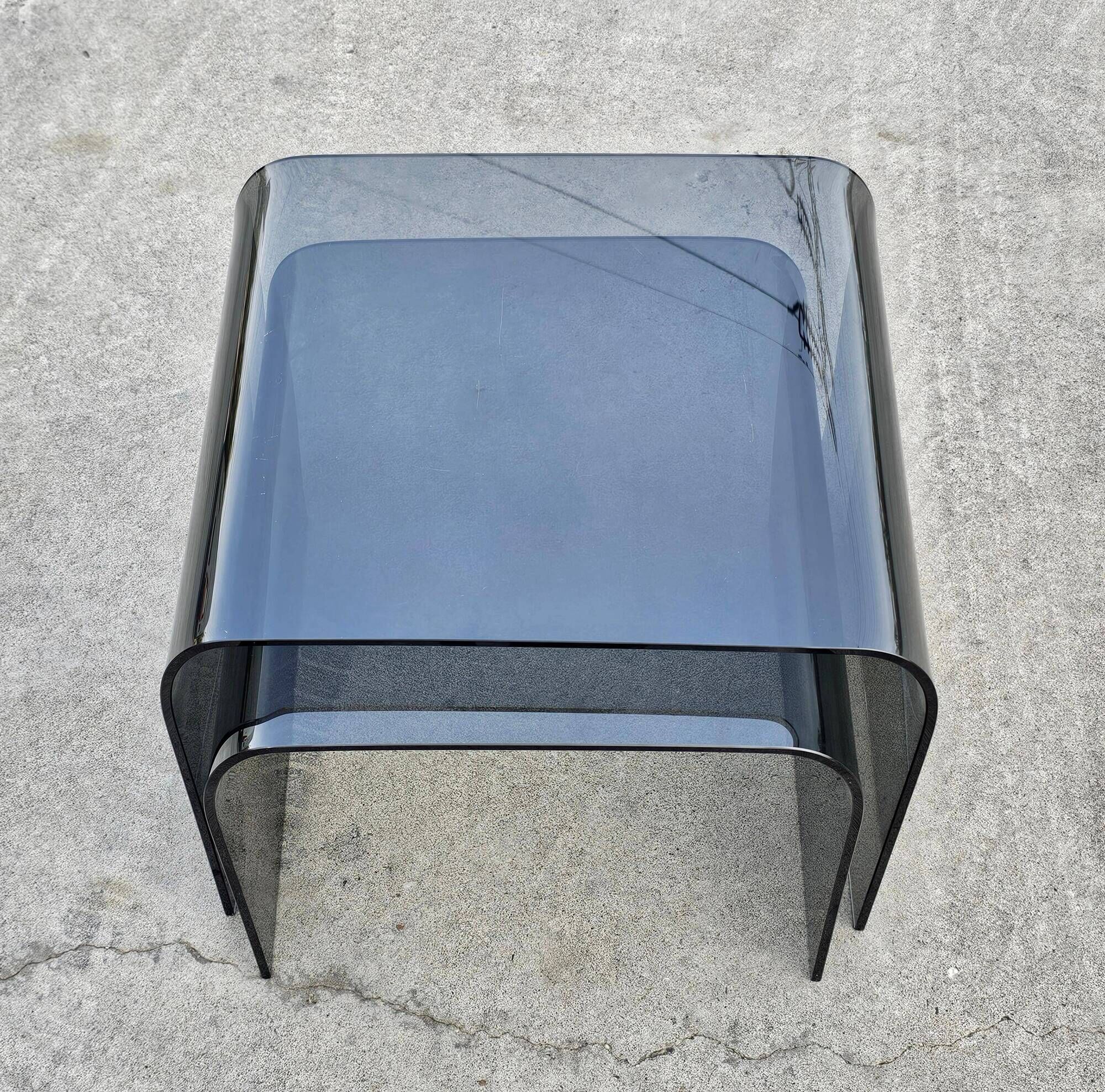 Pair of Waterfall nesting tables in tinted glass attributed to FIAM 1980s.