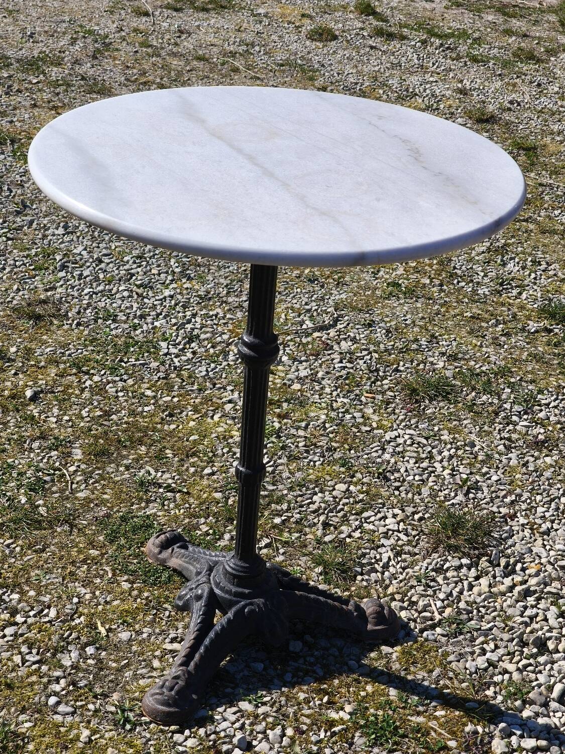 Marble bistro table with cast iron legs in Parisian café style