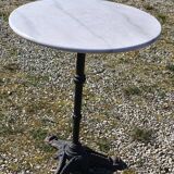 Marble bistro table with cast iron legs in Parisian café style