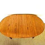 Oval teak dining table with extension