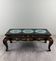 Black lacquered wooden coffee table with cloisonné and polychrome decoration, 20th century.