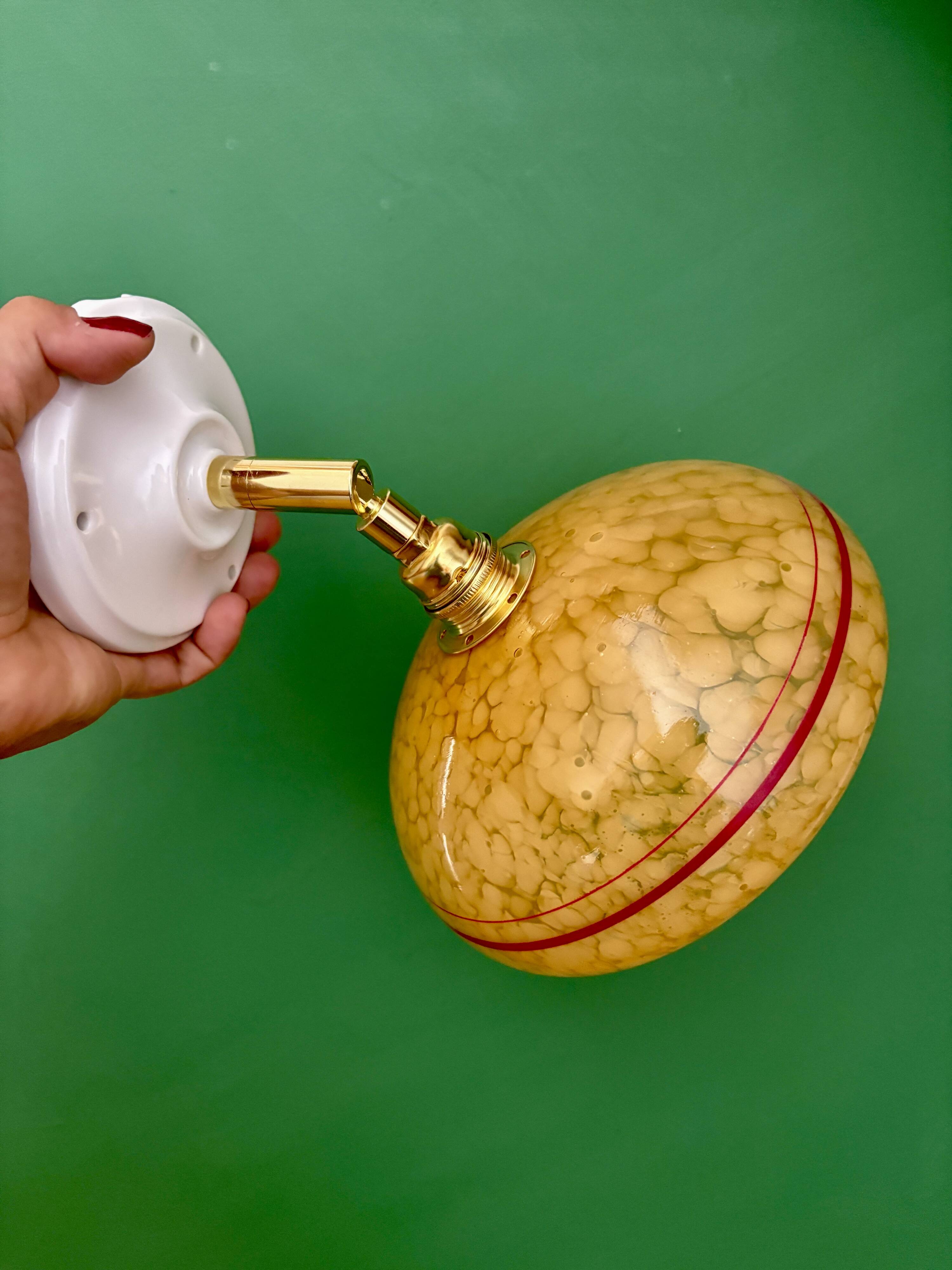 Vintage wall lamp with yellow clichy glass shade and red trim