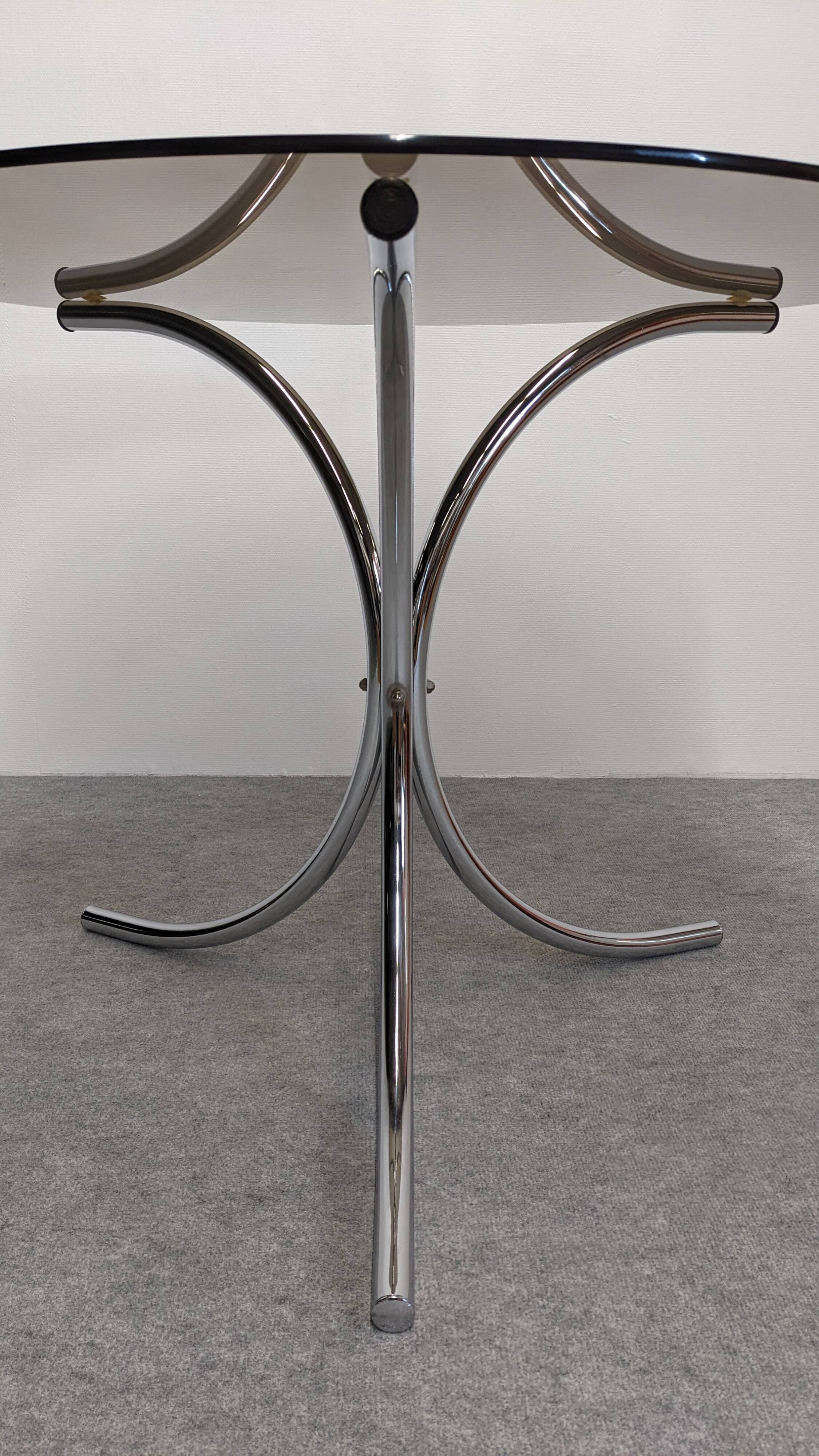 Chrome metal and smoked glass round table, Italy circa 1970.