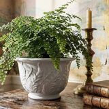 Antique cache-pot in Limoges porcelain with a relief decoration of foliage.