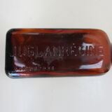 2 amber glass bottles with their old labels