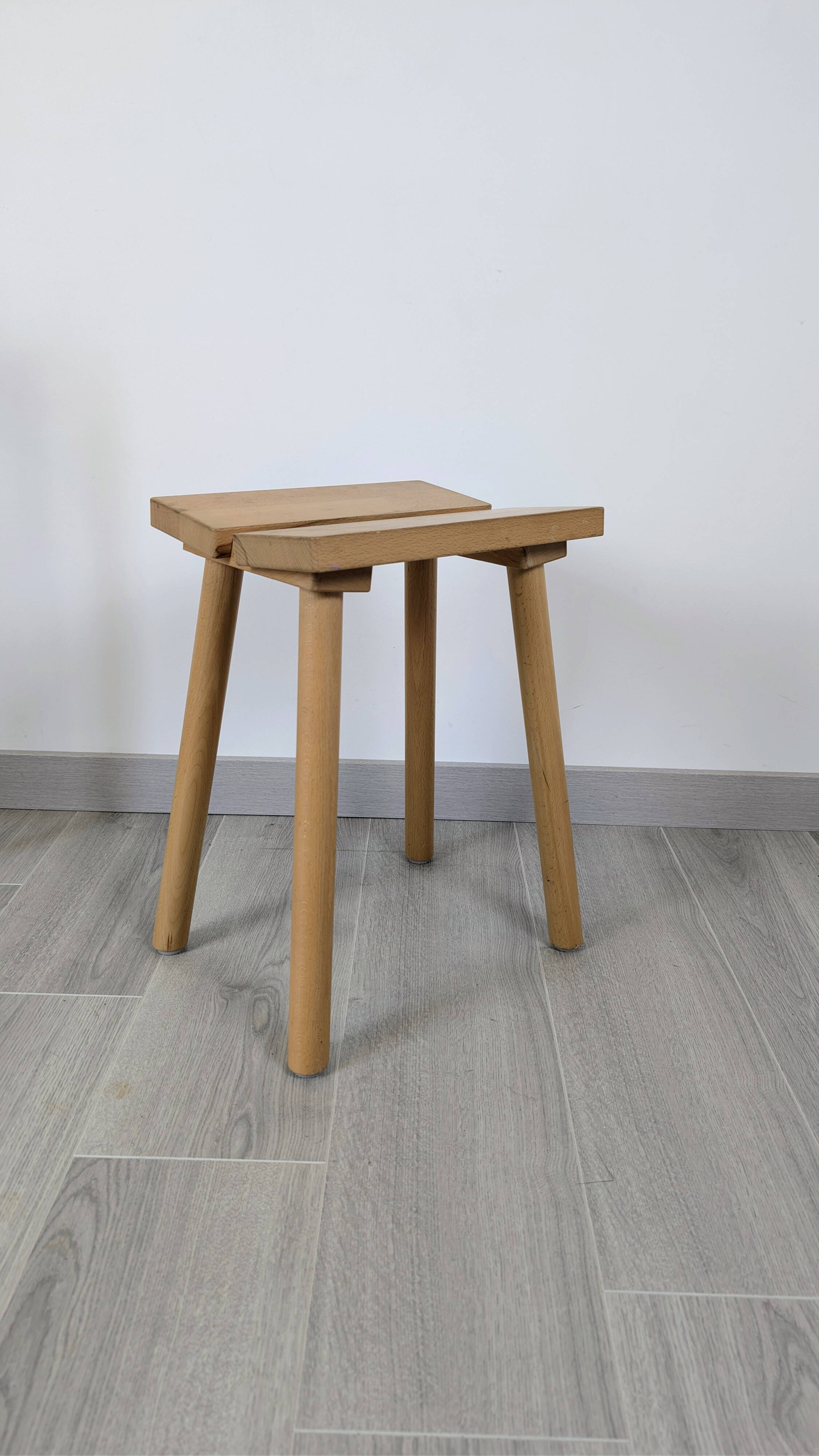 Nordic design wooden stool model ypperlig by ikea with a minimalist seat.