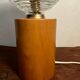 Cylindrical base lamp in solid wood and chiseled glass globe
