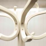 Parrot wears white Baumann coat 1970