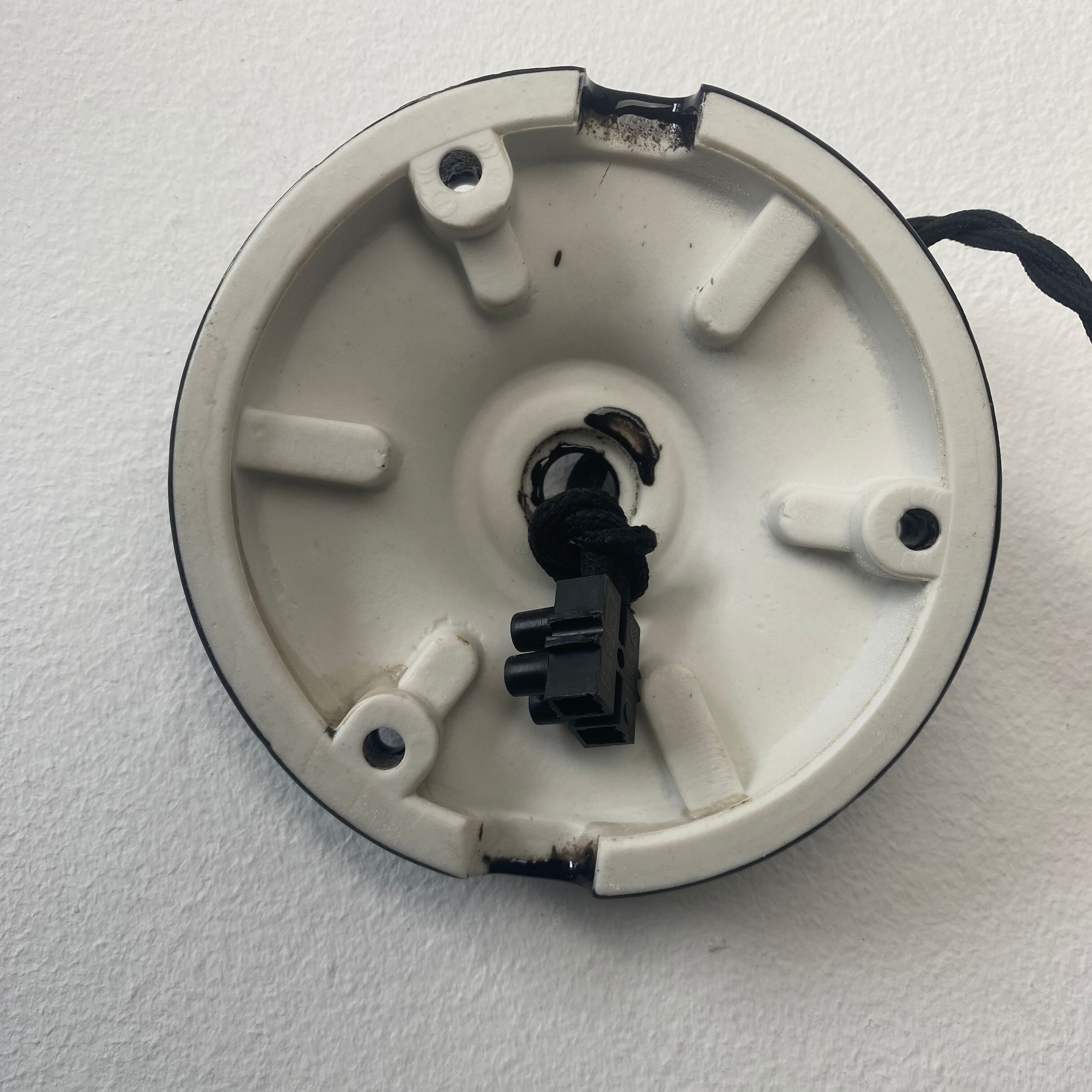 Old black enamelled industrial suspension