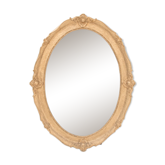 Antique oval mirror in a golden frame