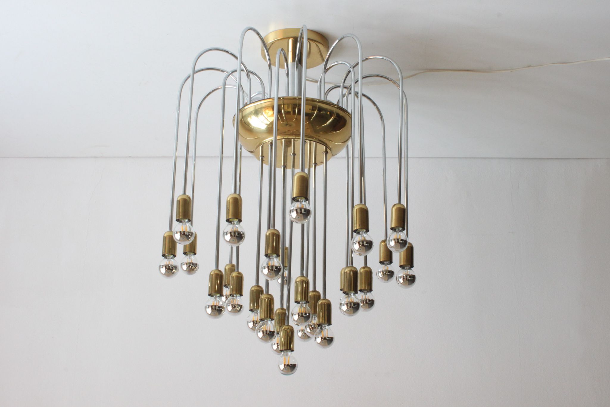 Tubular chrome and brass waterfall chandelier, Italy 1970s.