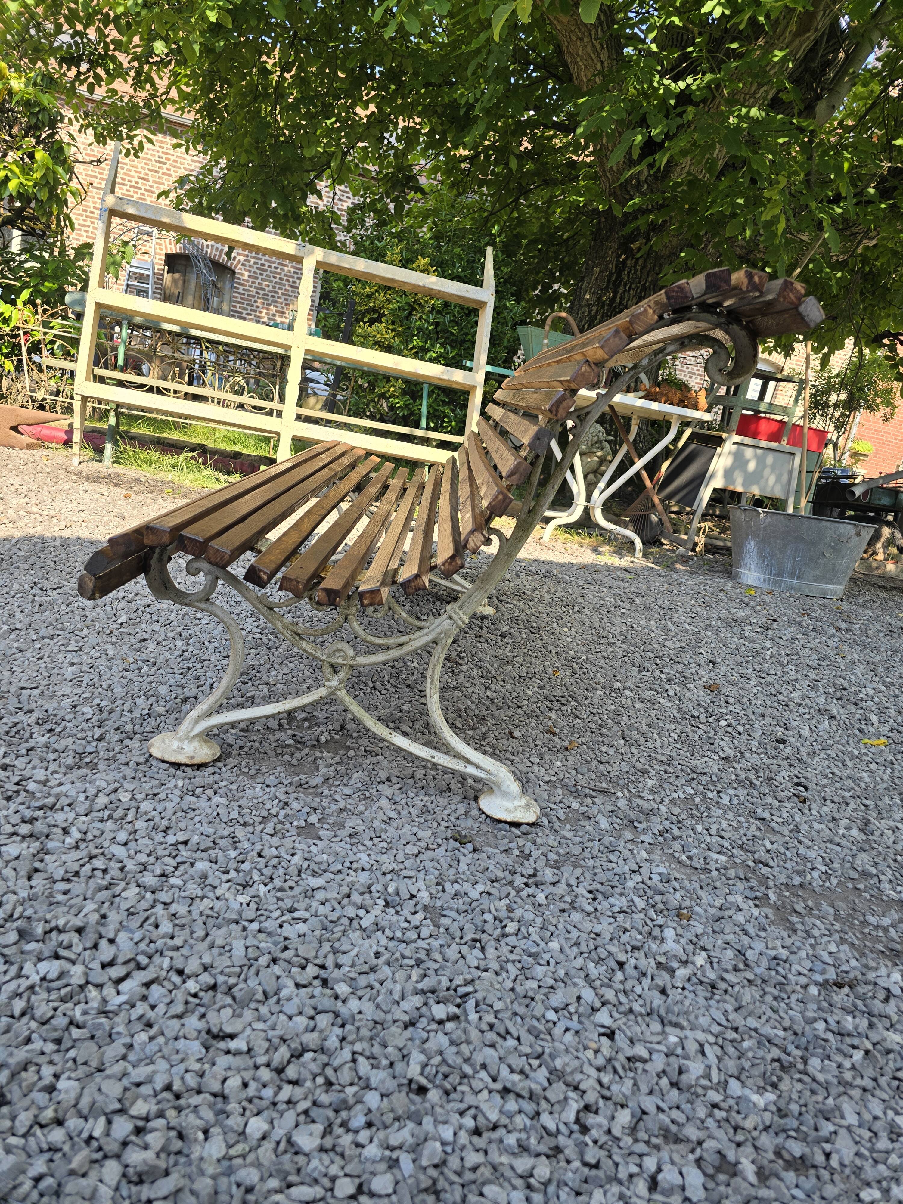 Garden bench with cast iron legs and oak slats