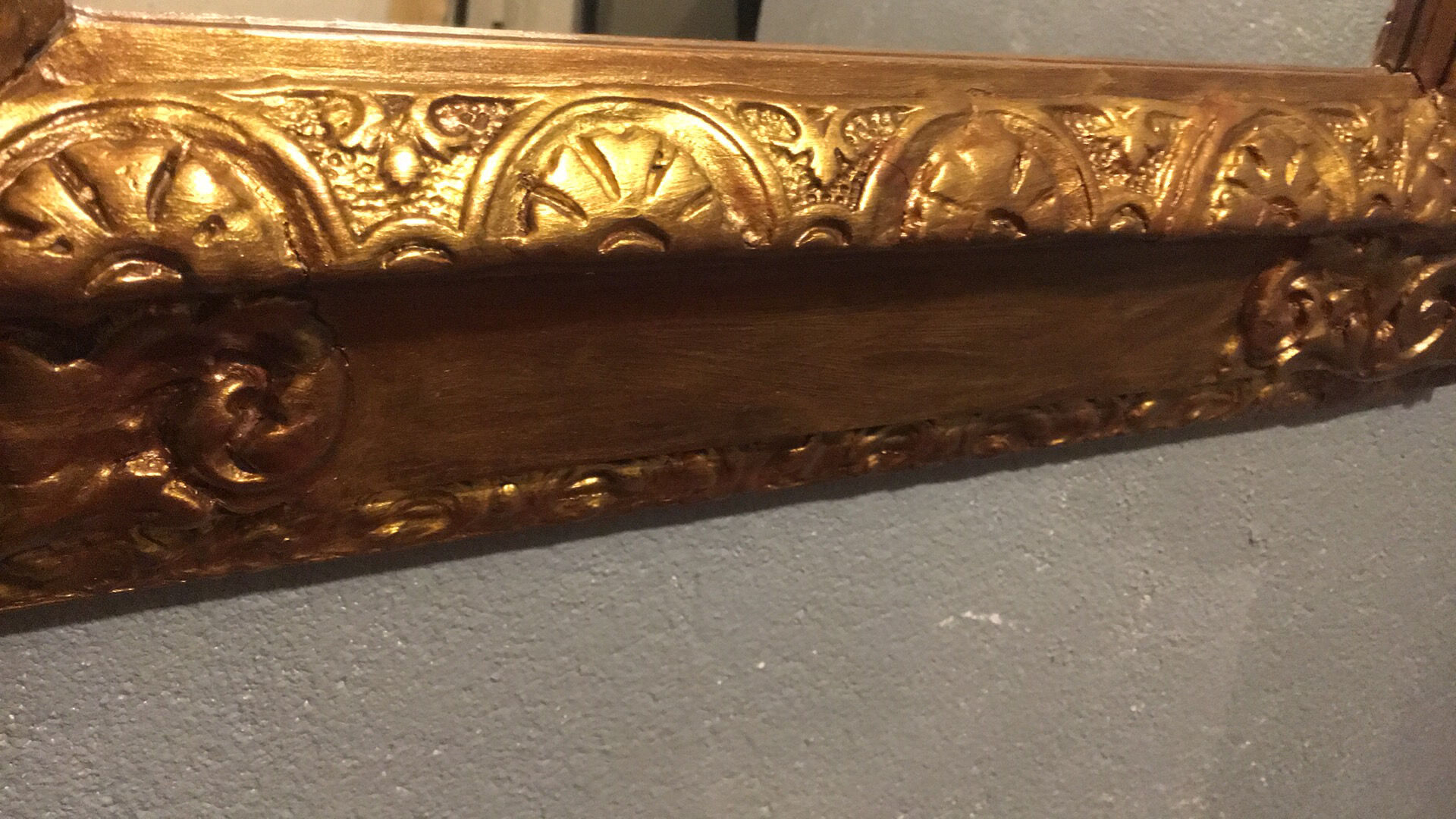 Mirror in gold frame