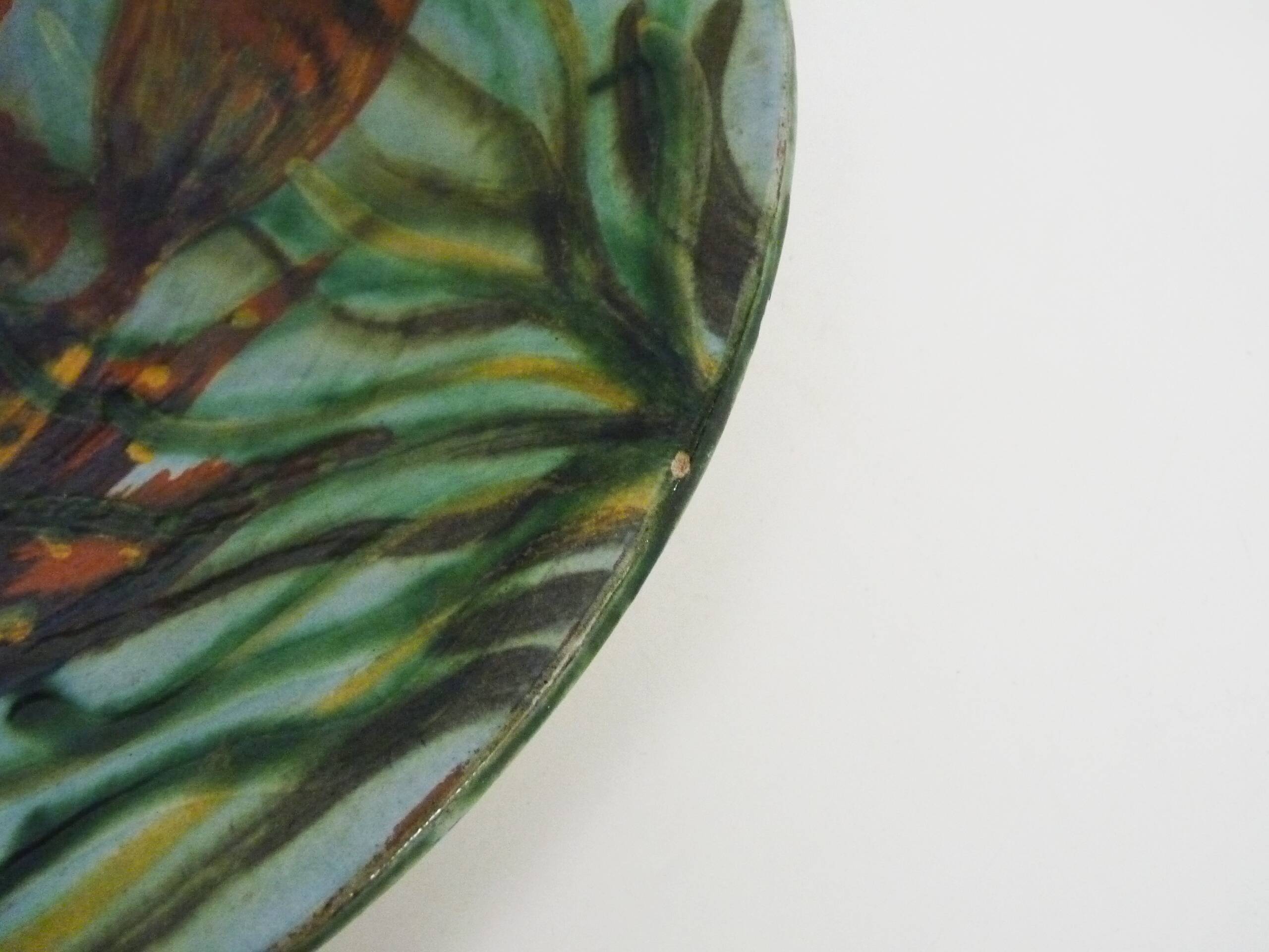 Decorative ceramic wall plate with fish decoration by Puigdemont.