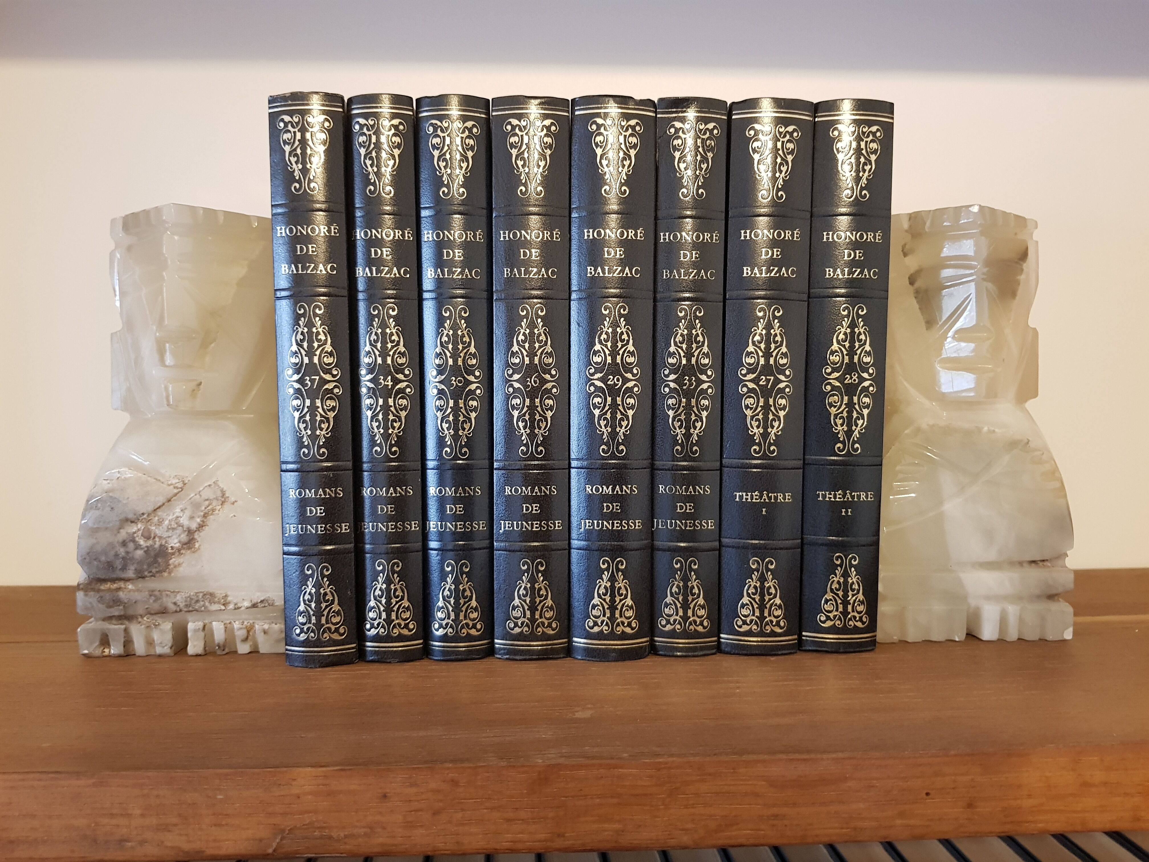 Onyx book clambands depicting an Aztec statue
