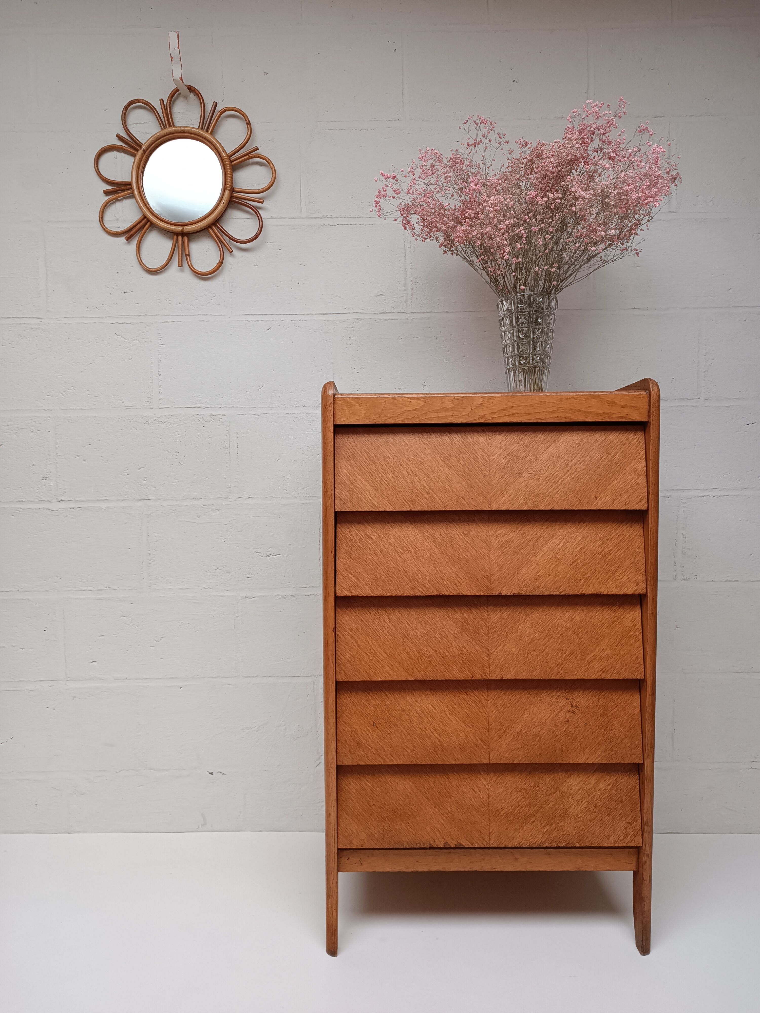 High wooden chest of drawers in the 50s