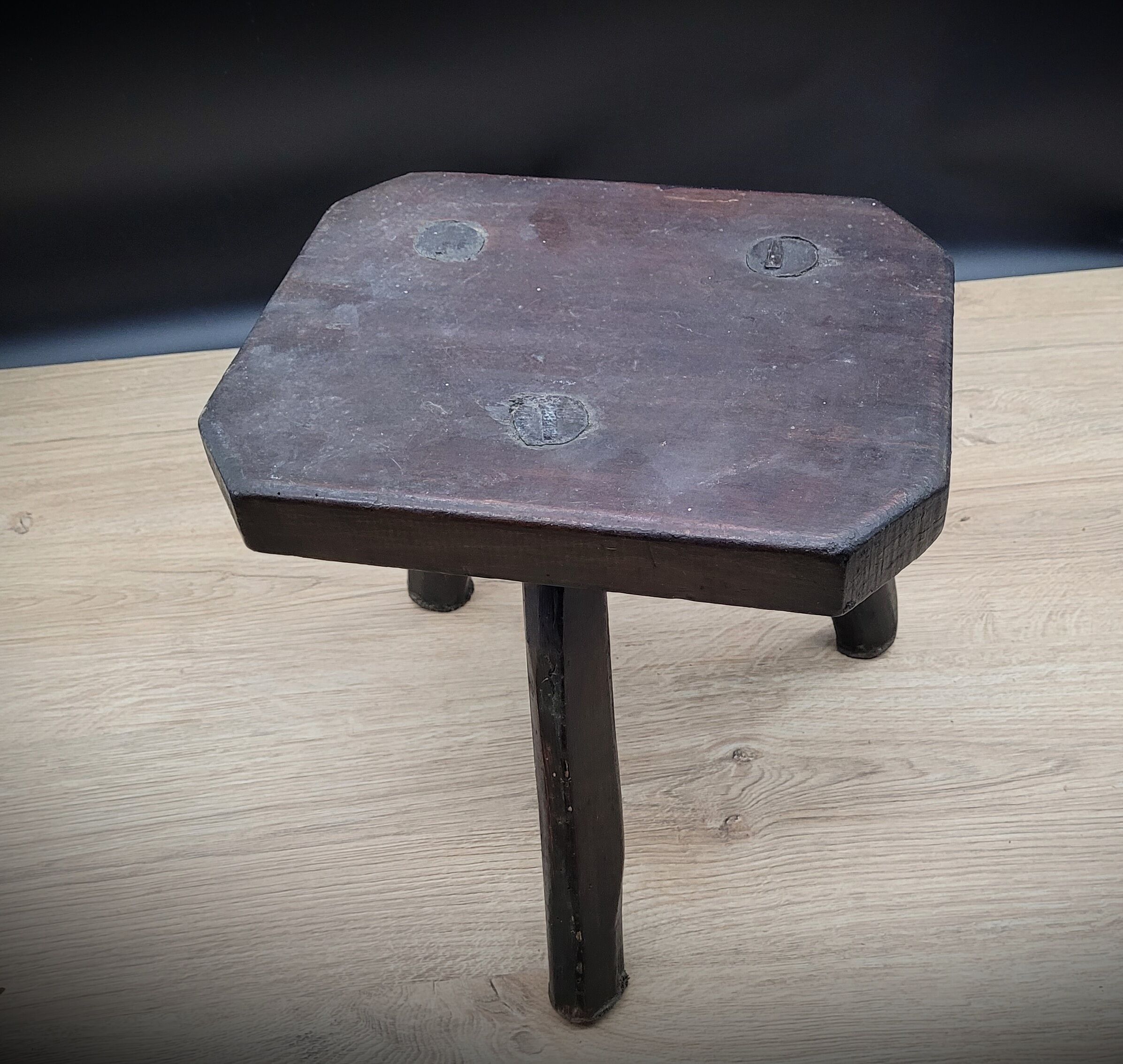 Dark octagon tripod stool