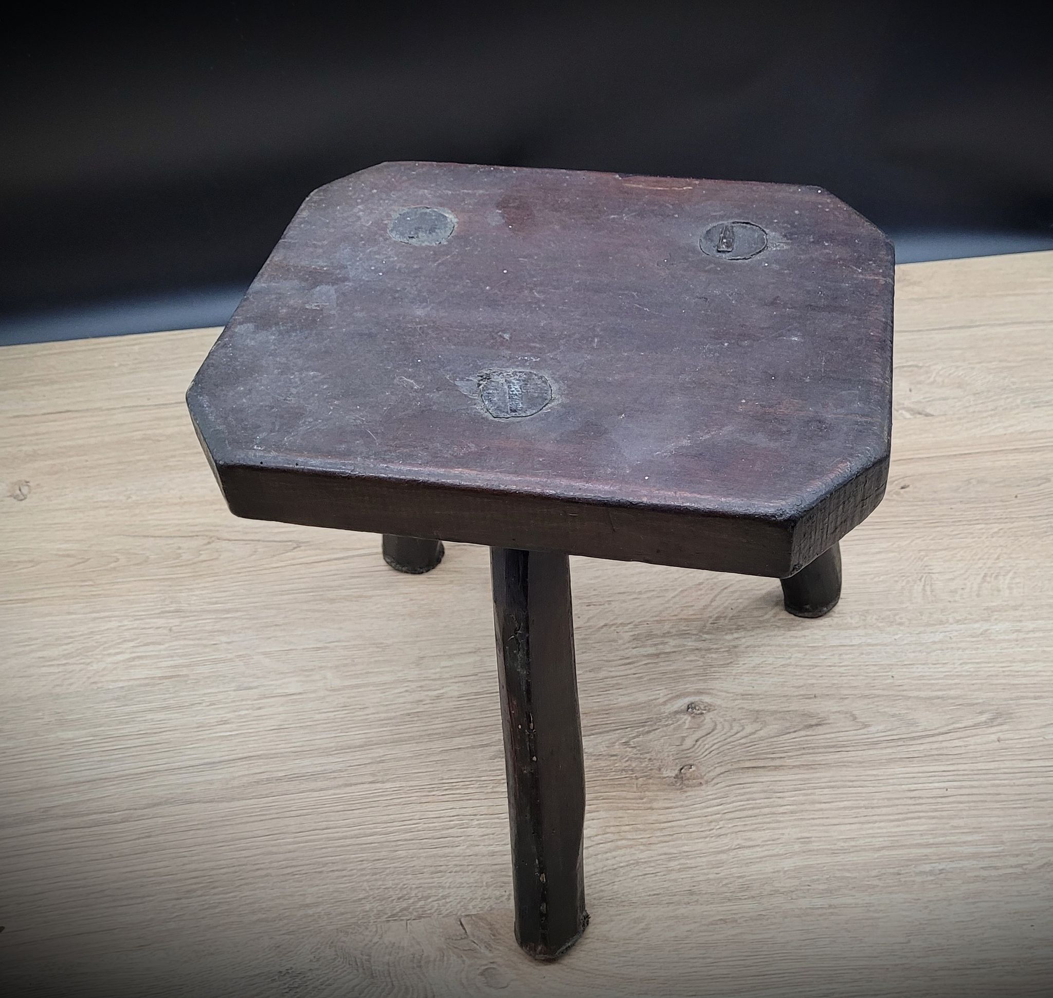 Dark octagon tripod stool