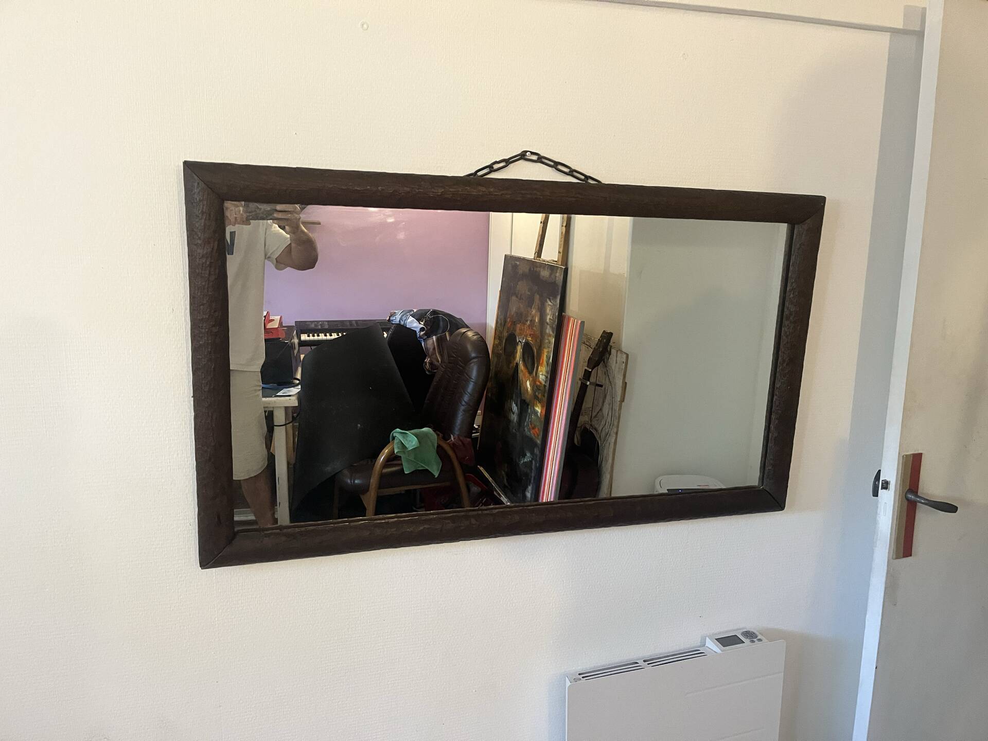 Large vintage mirror with a carved solid wood frame.