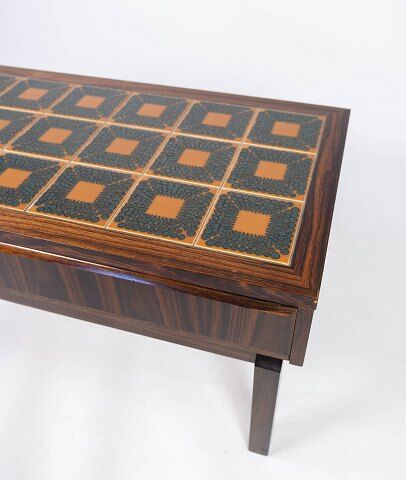 Low chest in rosewood and tiles, of danish design from the 1960s.