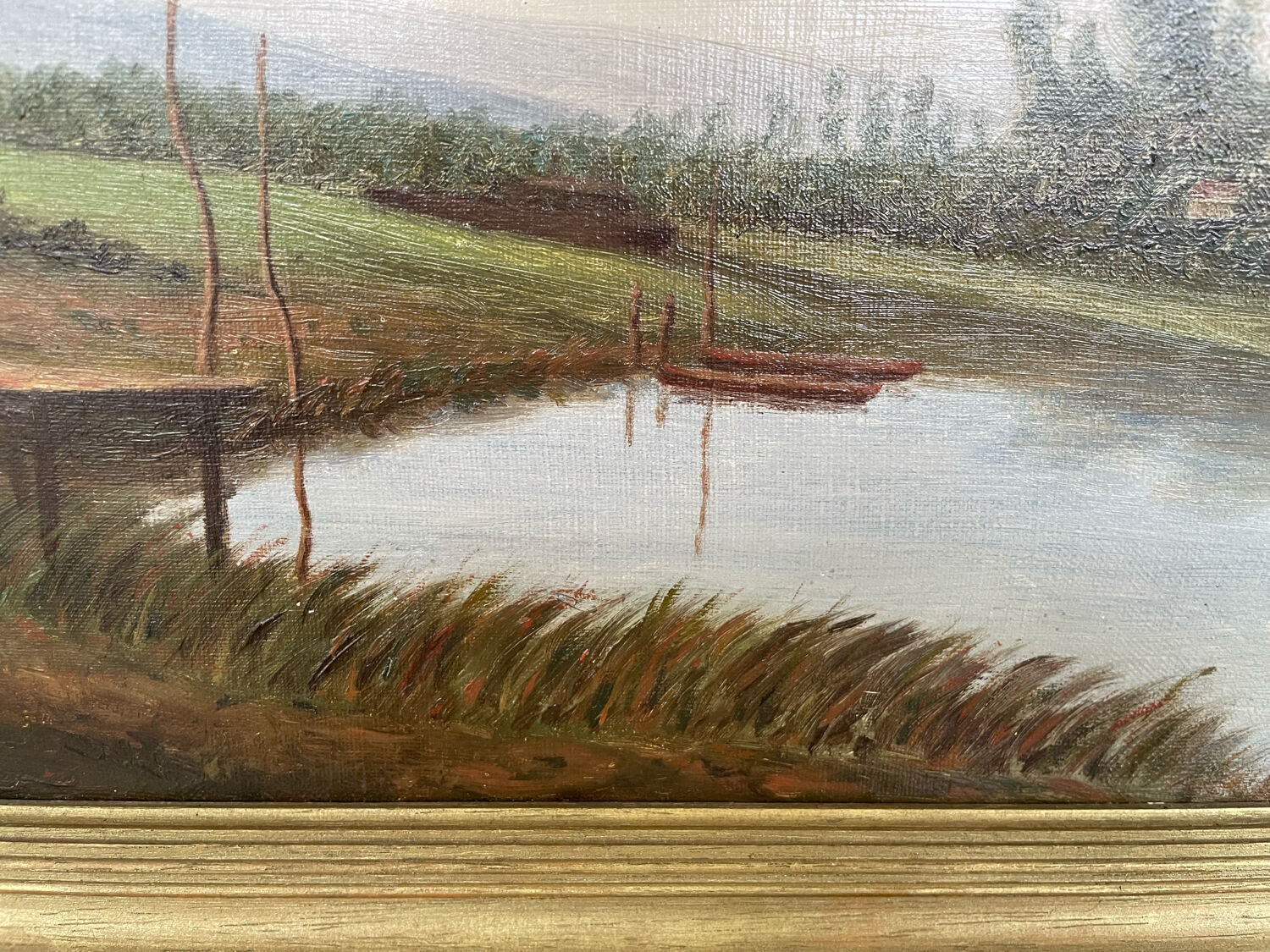 Oil painting of a riverside signed EM