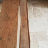 Church bench in fir tree with armrests