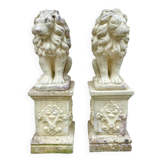 Magnificent pair of lion statues of garden decoration on patterned stand