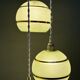 Suspension triple vintage glass globes in frosted green and gold.