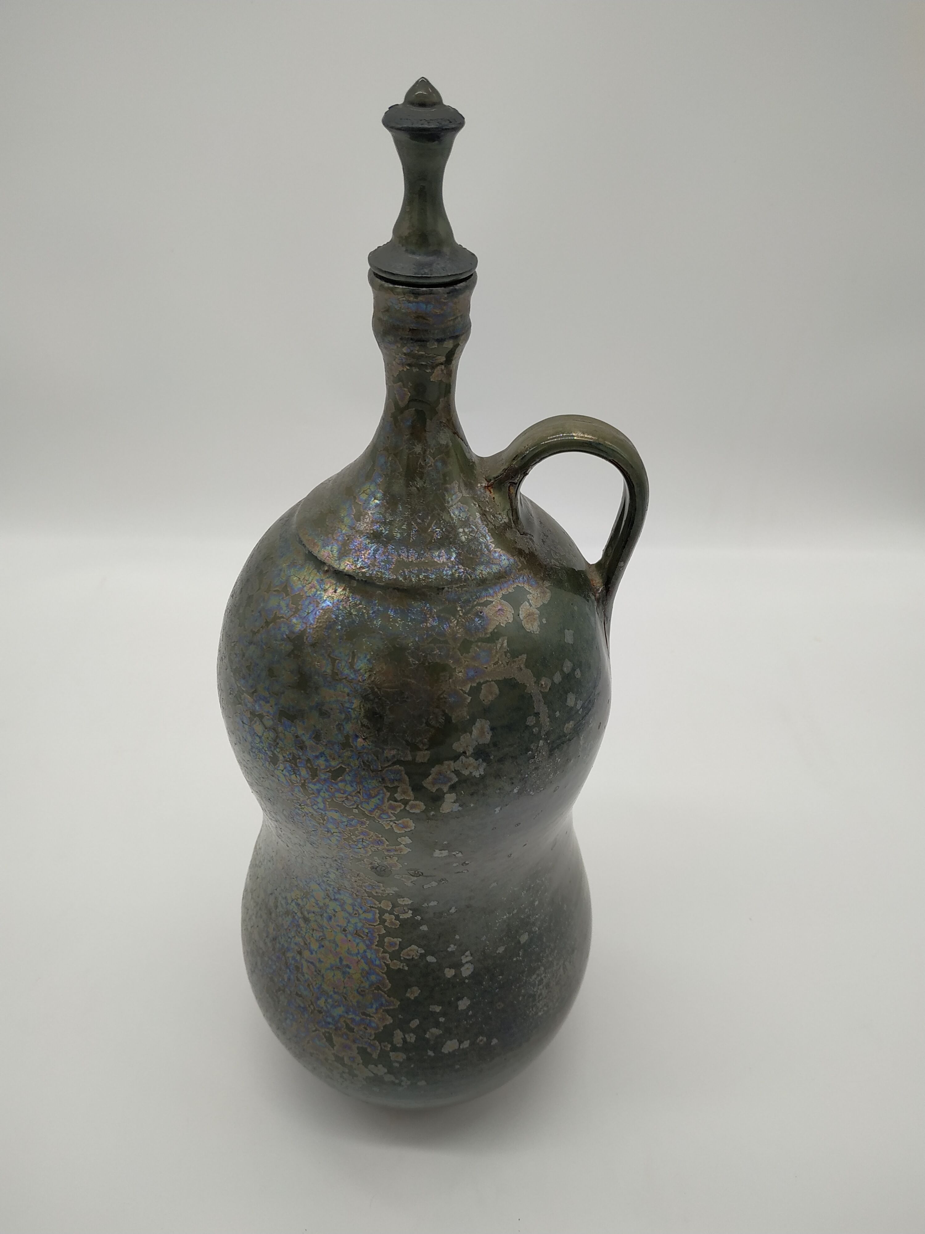 Bottle in iridescent green sandstone from the ceramist jean aimé Poirier