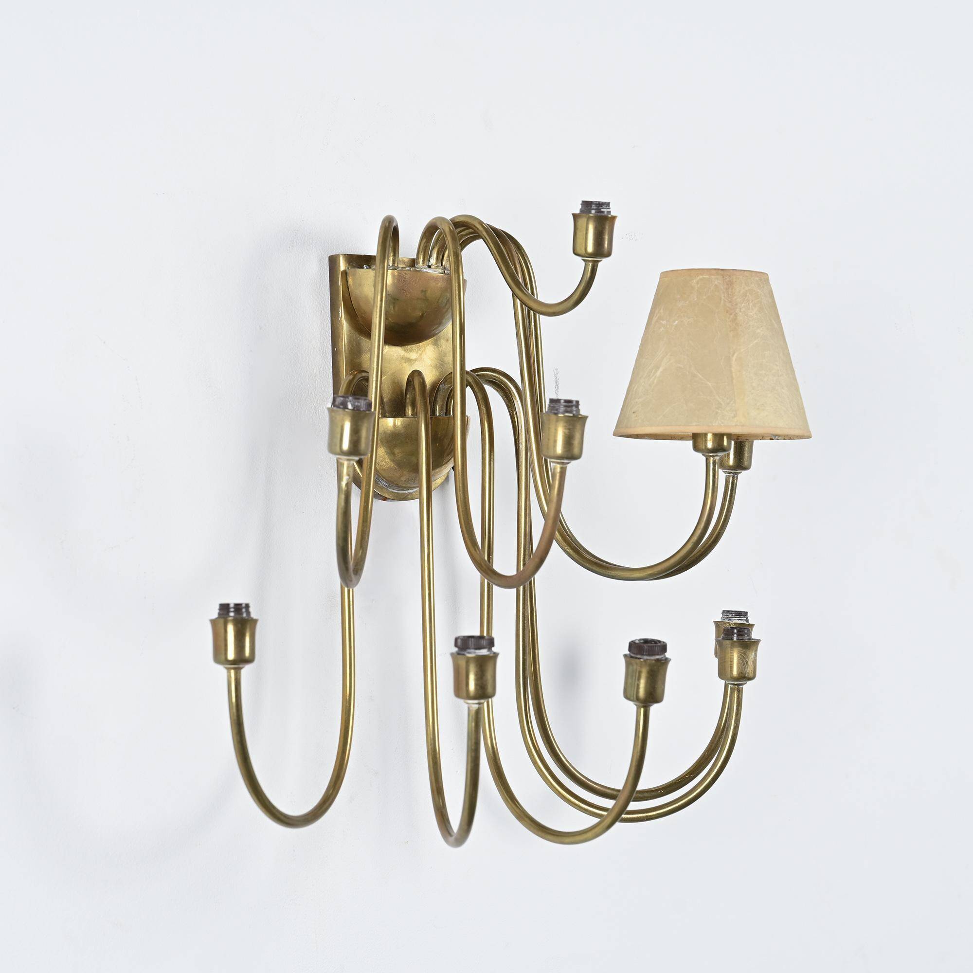 Wall sconce with nine arms in brass, France, circa 1950.