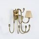 Wall sconce with nine arms in brass, France, circa 1950.