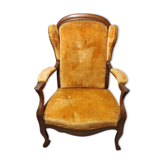 Voltaire armchair covered with velvet