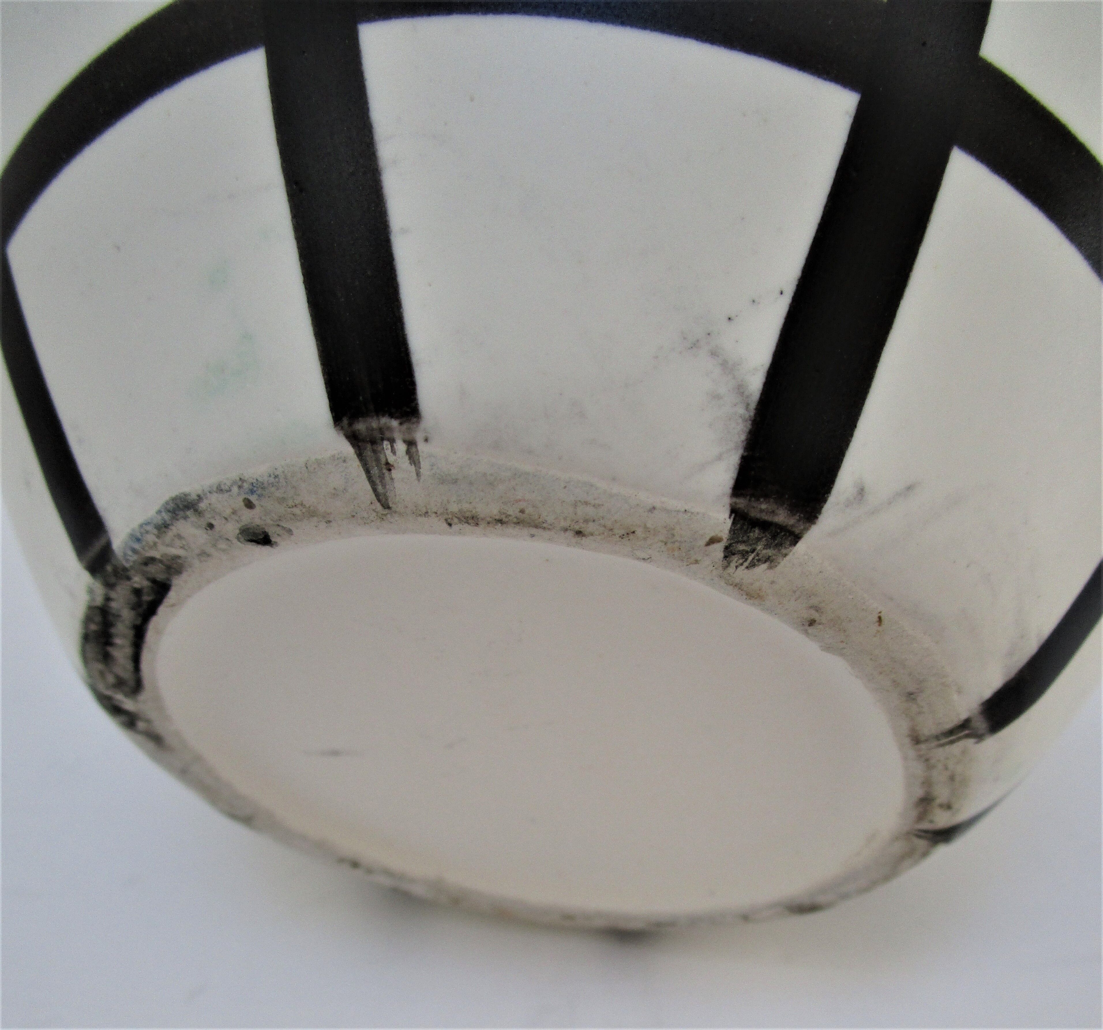 pineau bottle and ceramic cup by Lili Voltz 60s