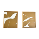 Diptych relief panels with a brown camel and cream background.