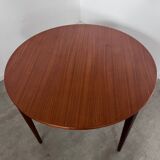 Round teak table with Scandinavian design extensions from the 60s vintage