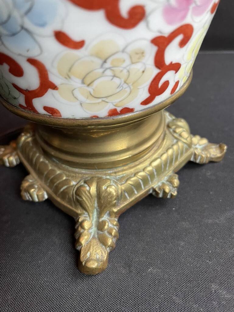 Old Asian vase mounted as a lamp with pagoda lampshade