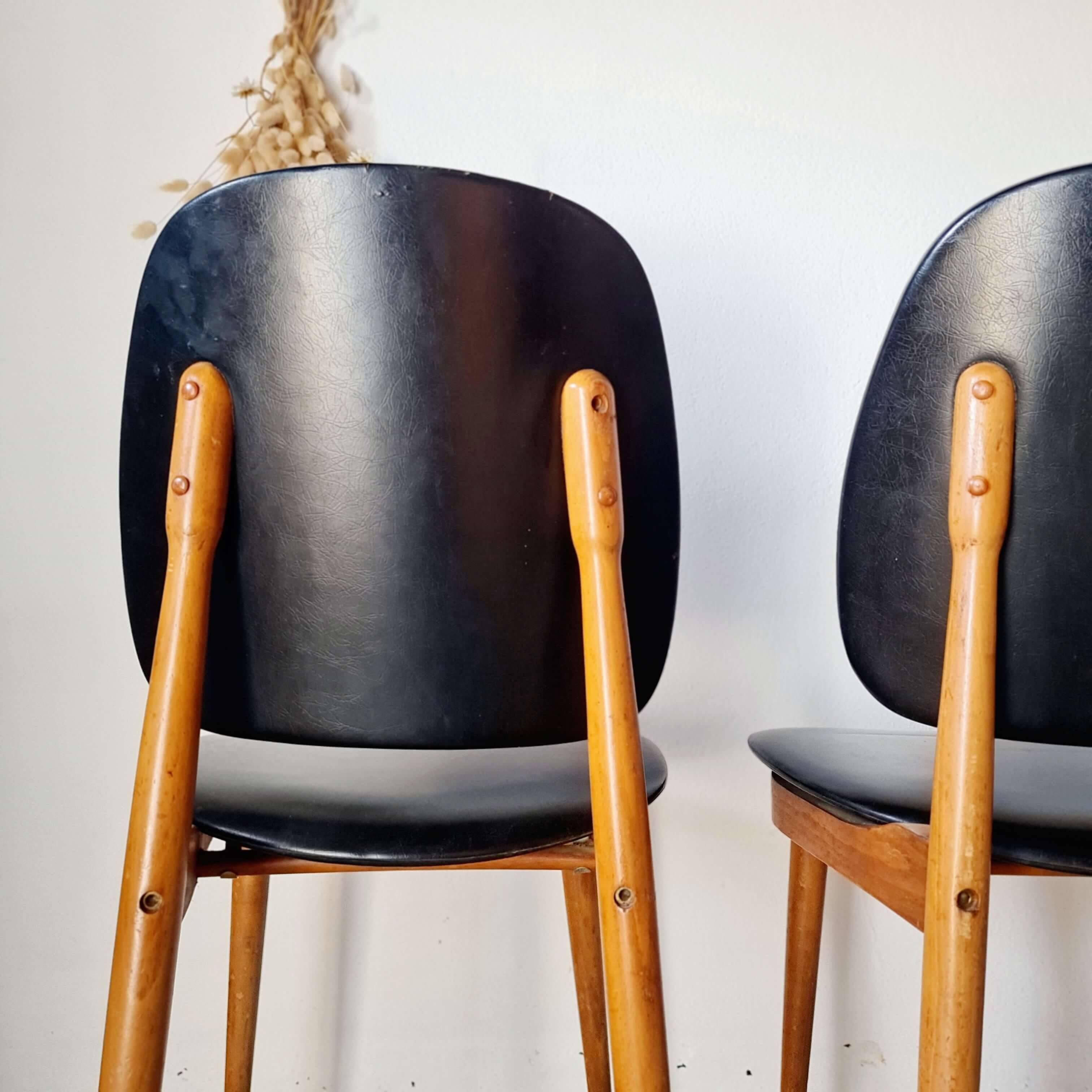 Paire de chaises vintage 1960 – Pieds compas & Simili-cuir noir
