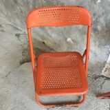 Trio of orange metal folding chairs - vintage