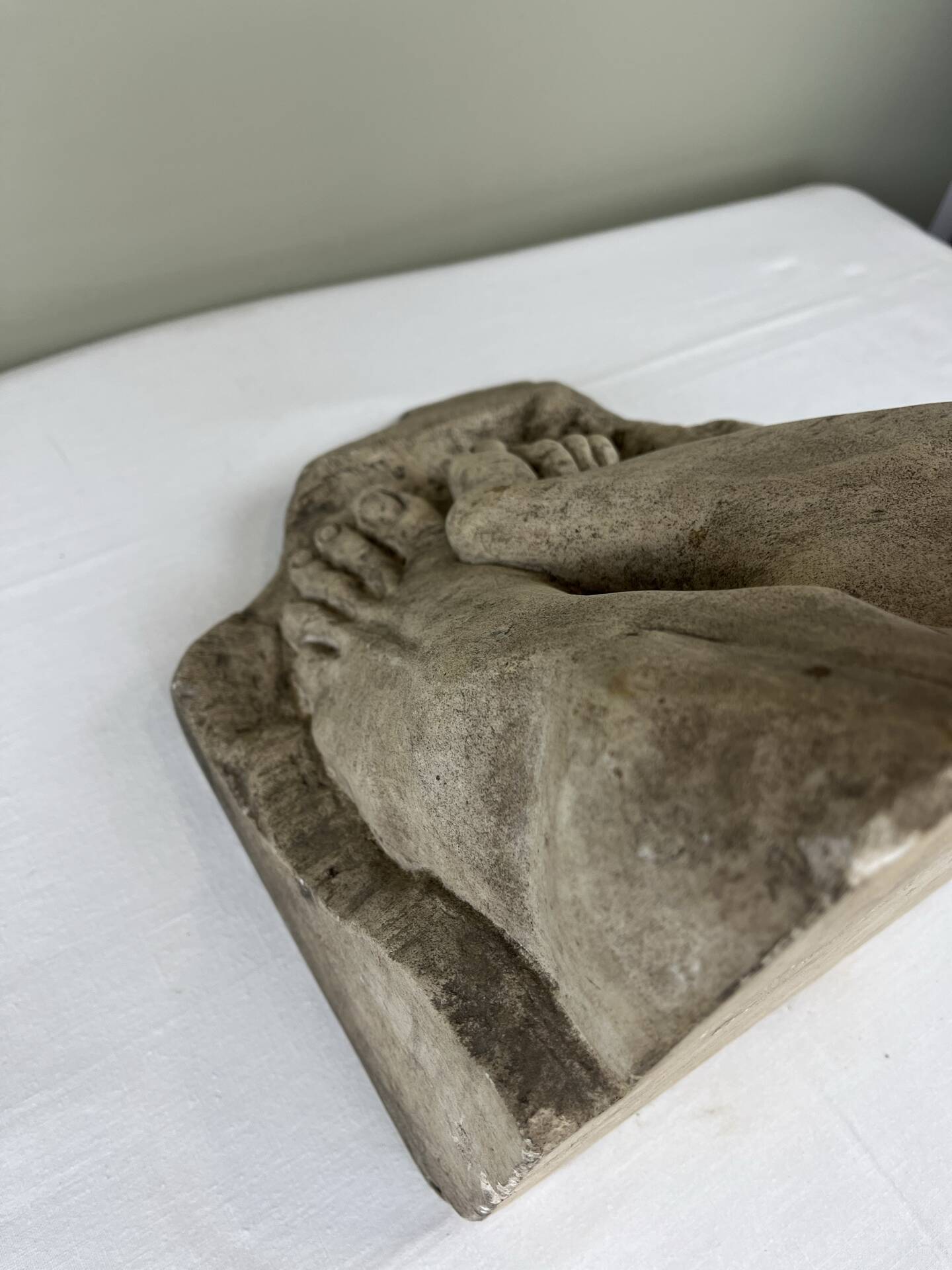 Stone sculpture, two feet on a block, signed D. Paillot.