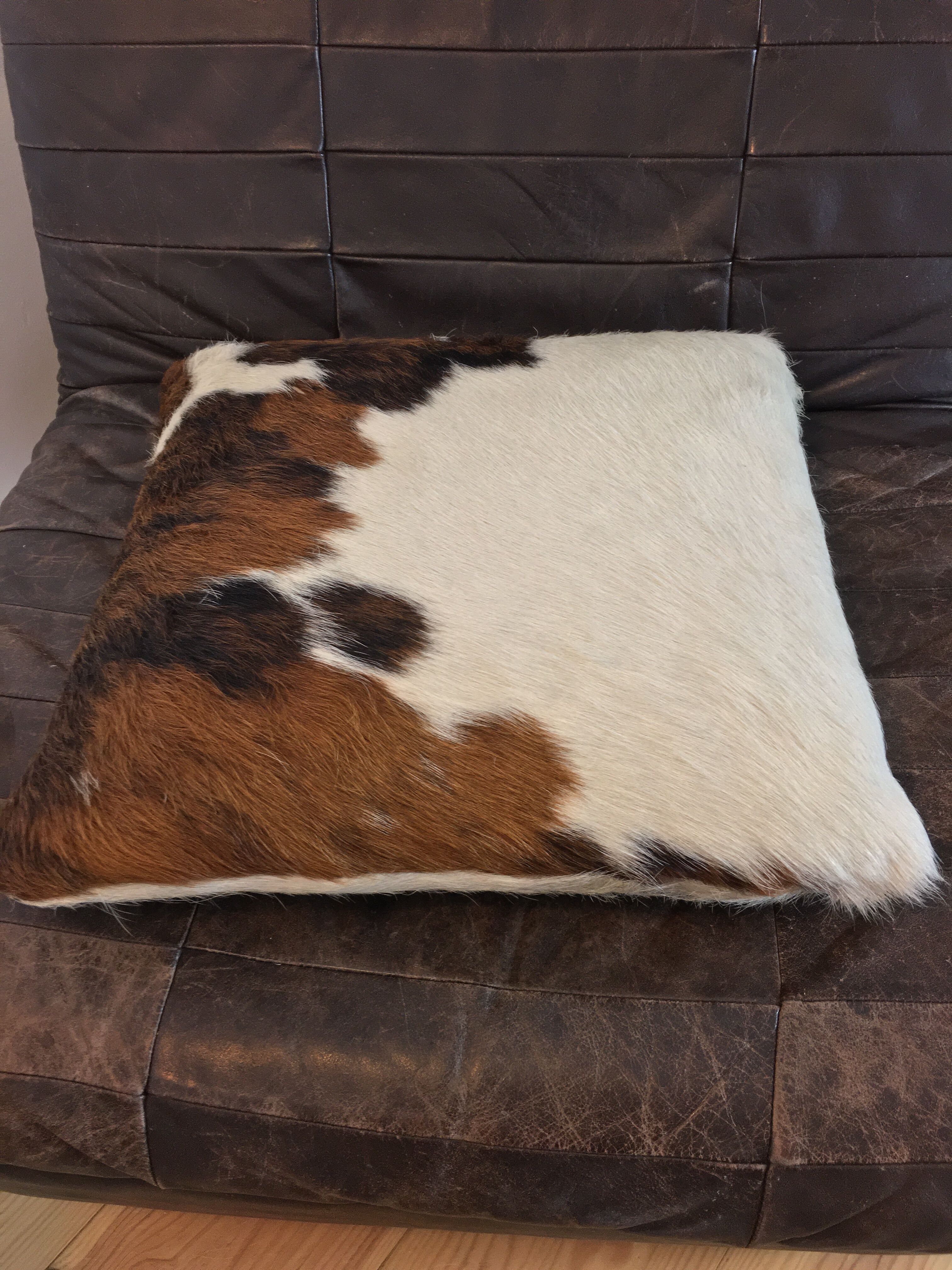 Pouf and cow cushion, leather