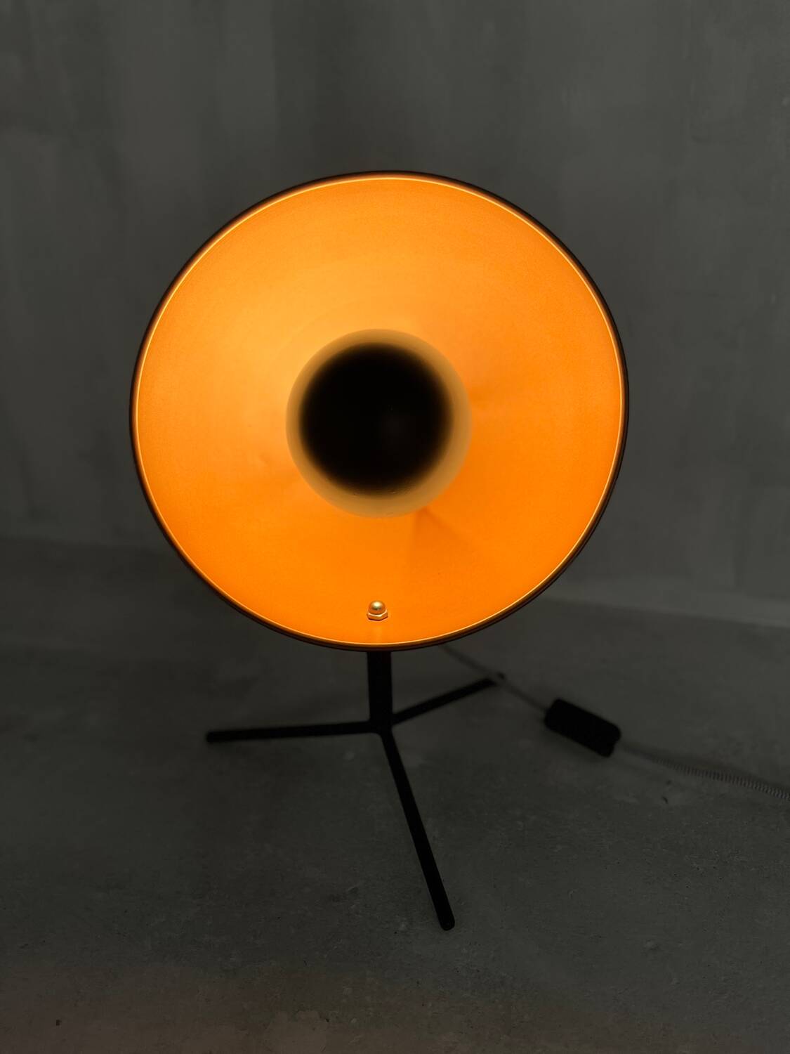 Vintage industrial lamp with a metal frame.