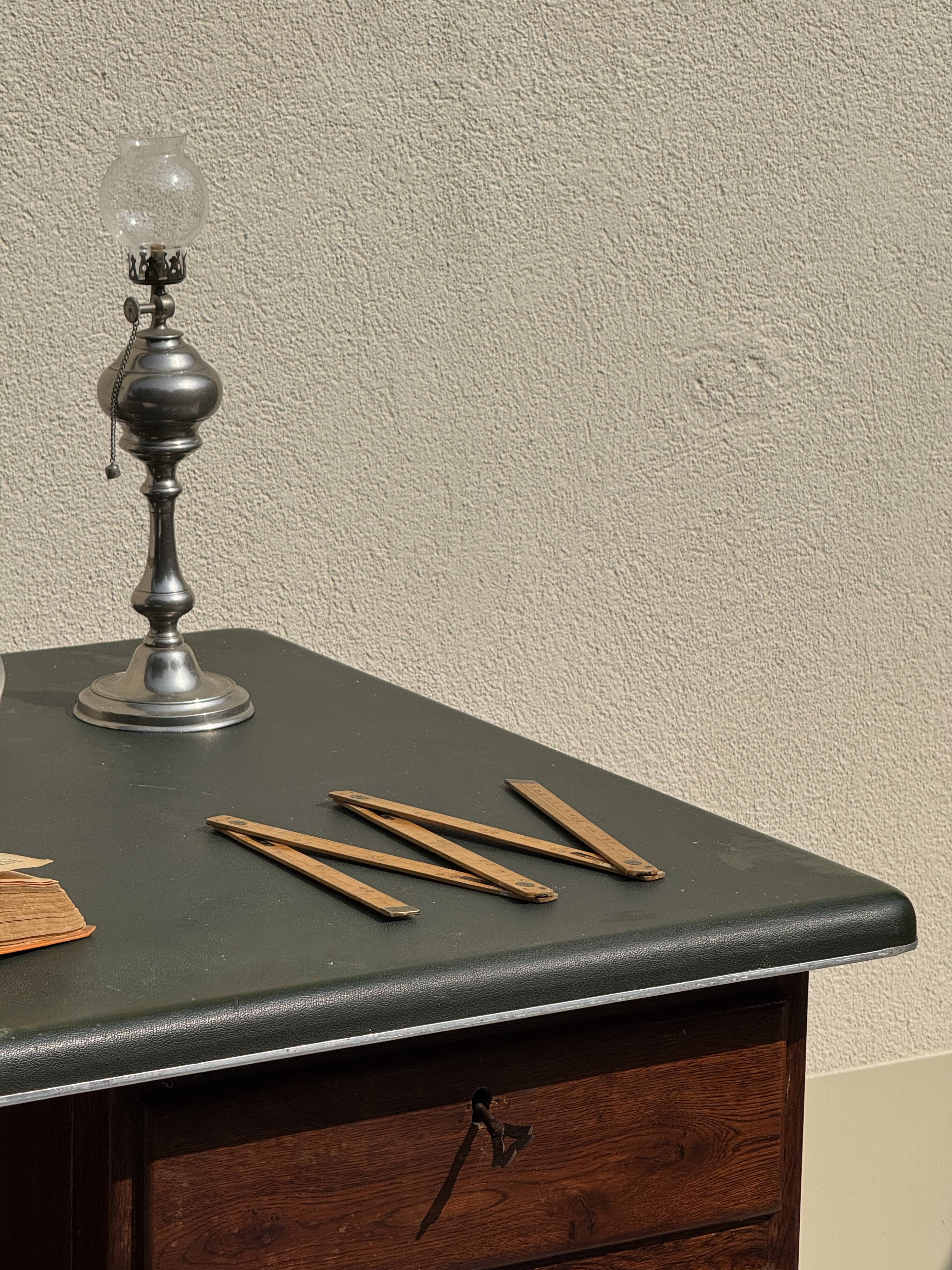 Modernist desk in wood and green moleskin upholstery