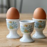 Vintage white porcelain egg cups with floral pattern