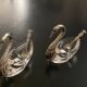 2 swan-shaped salt pots in metal and glass
