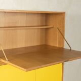 Classic sideboard from the 1960s, oak veneer, yellow Resopal, white steel feet