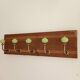 Wall-mounted coat rack with 5 hooks in sage green, stained wood and patinated metal – 50cm